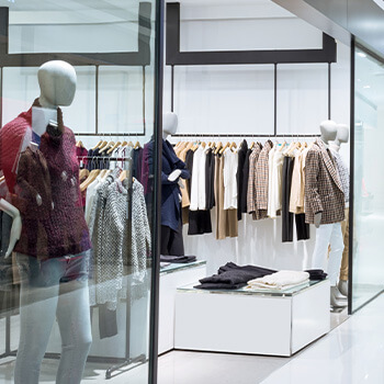 A store with mannequins and clothing on display.